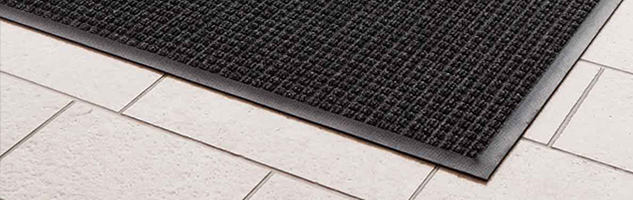 Rubber backed barrier mat