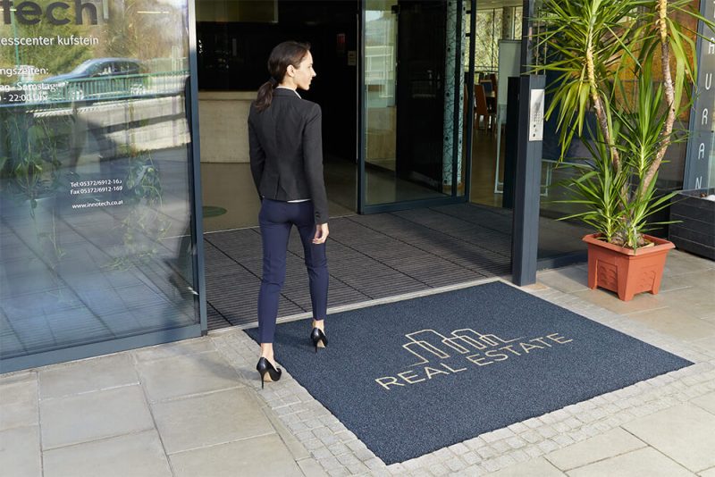 Outdoor logo mat used outside of an office building