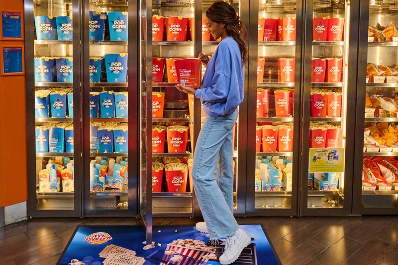 Promotional logo mat in front of cinema snack fridge